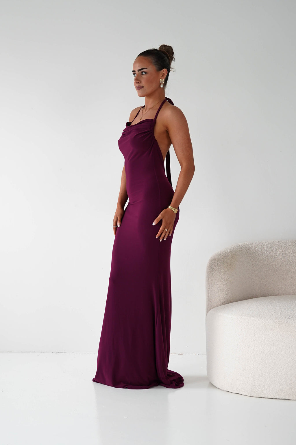 Maia Multi-Way Bodycon Maxi Dress in wine – seated view | Velora premium burgundy dresses