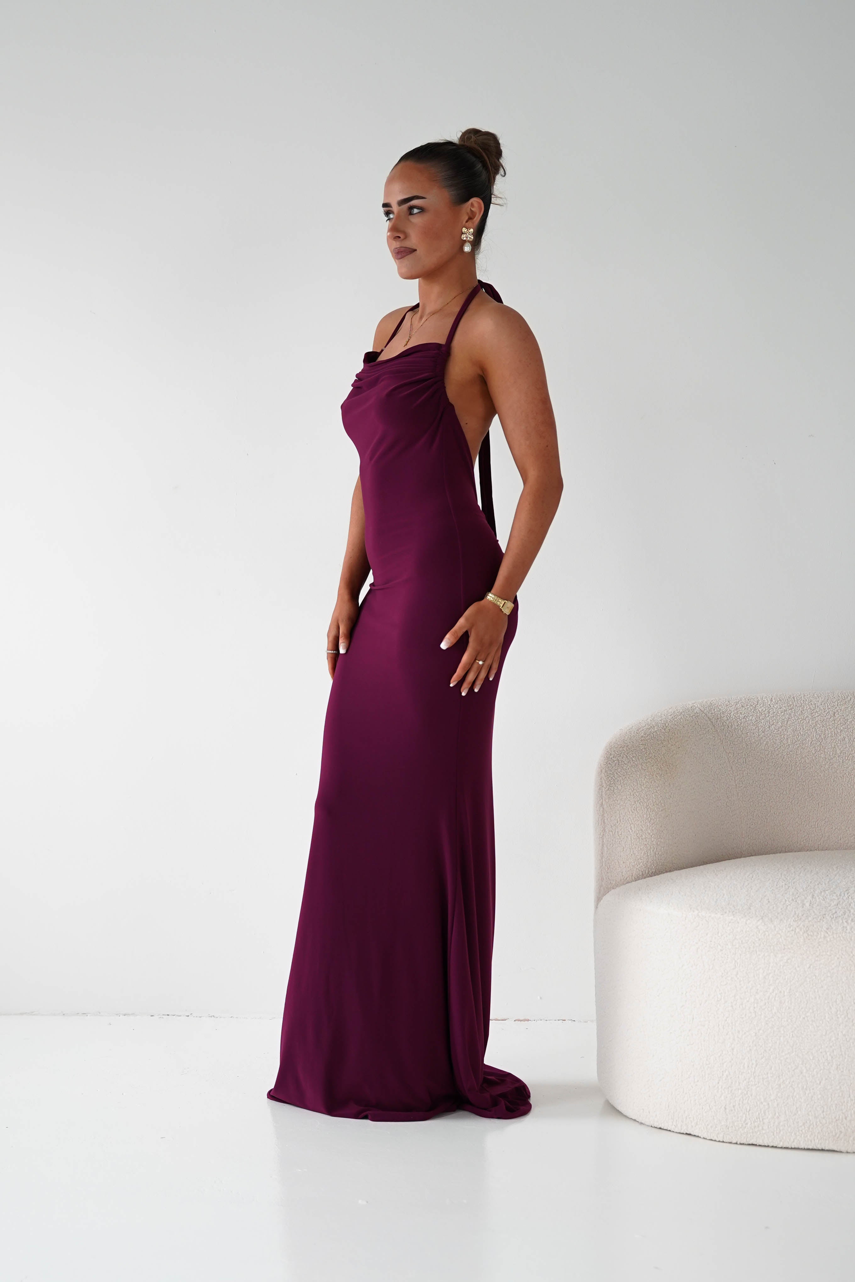 Maia Multi-Way Bodycon Maxi Dress in wine – seated view | Velora premium burgundy dresses