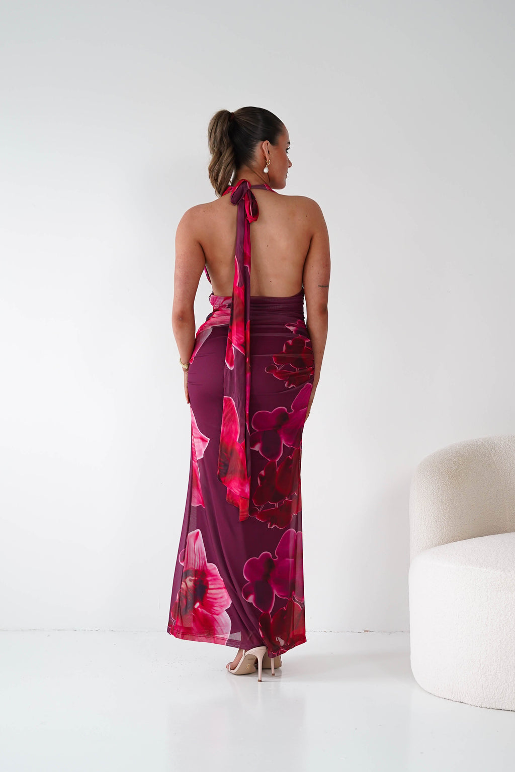Marloe Floral Tie-Back Ruched Maxi Dress in wine – seated view | Velora premium burgundy dresses