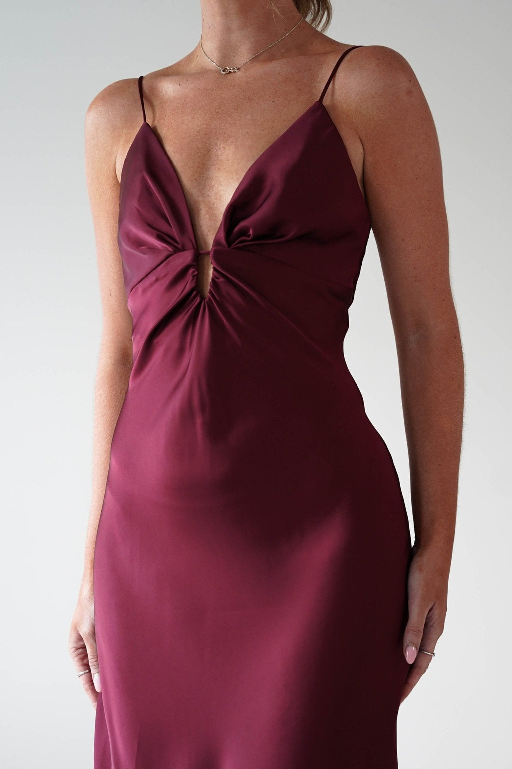 Adley Soft Satin Maxi Dress in burgundy – hem detail | Velora premium burgundy dresses