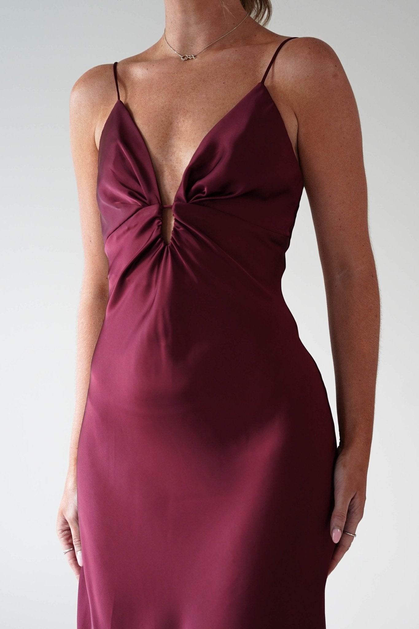Adley Soft Satin Maxi Dress in burgundy – hem detail | Velora premium burgundy dresses