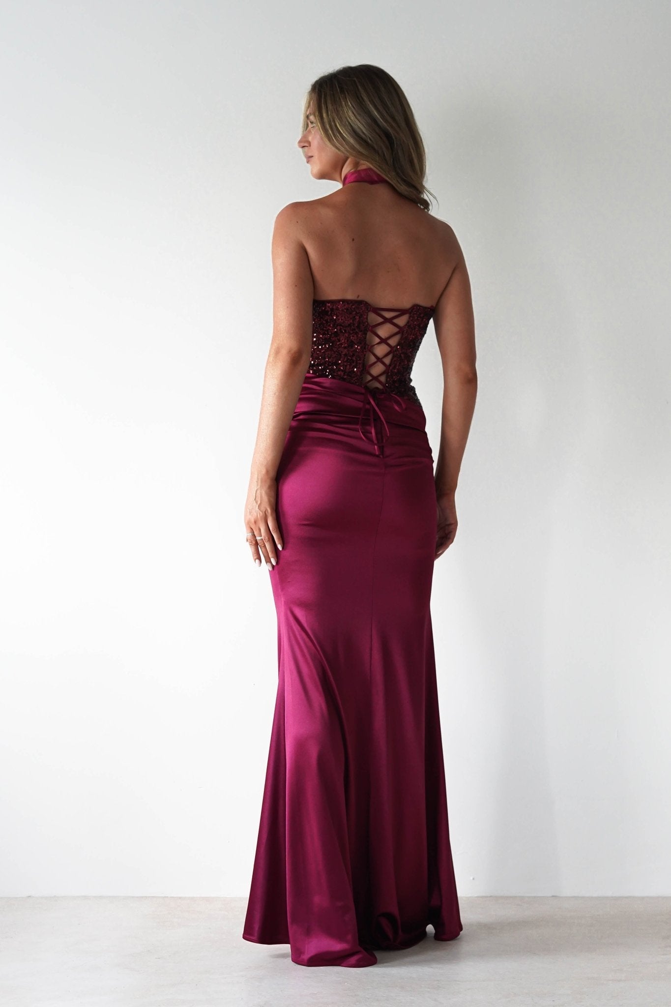 Elysia Sequin Embellished Bodice Gown in wine – styled with heels | Velora premium burgundy dresses