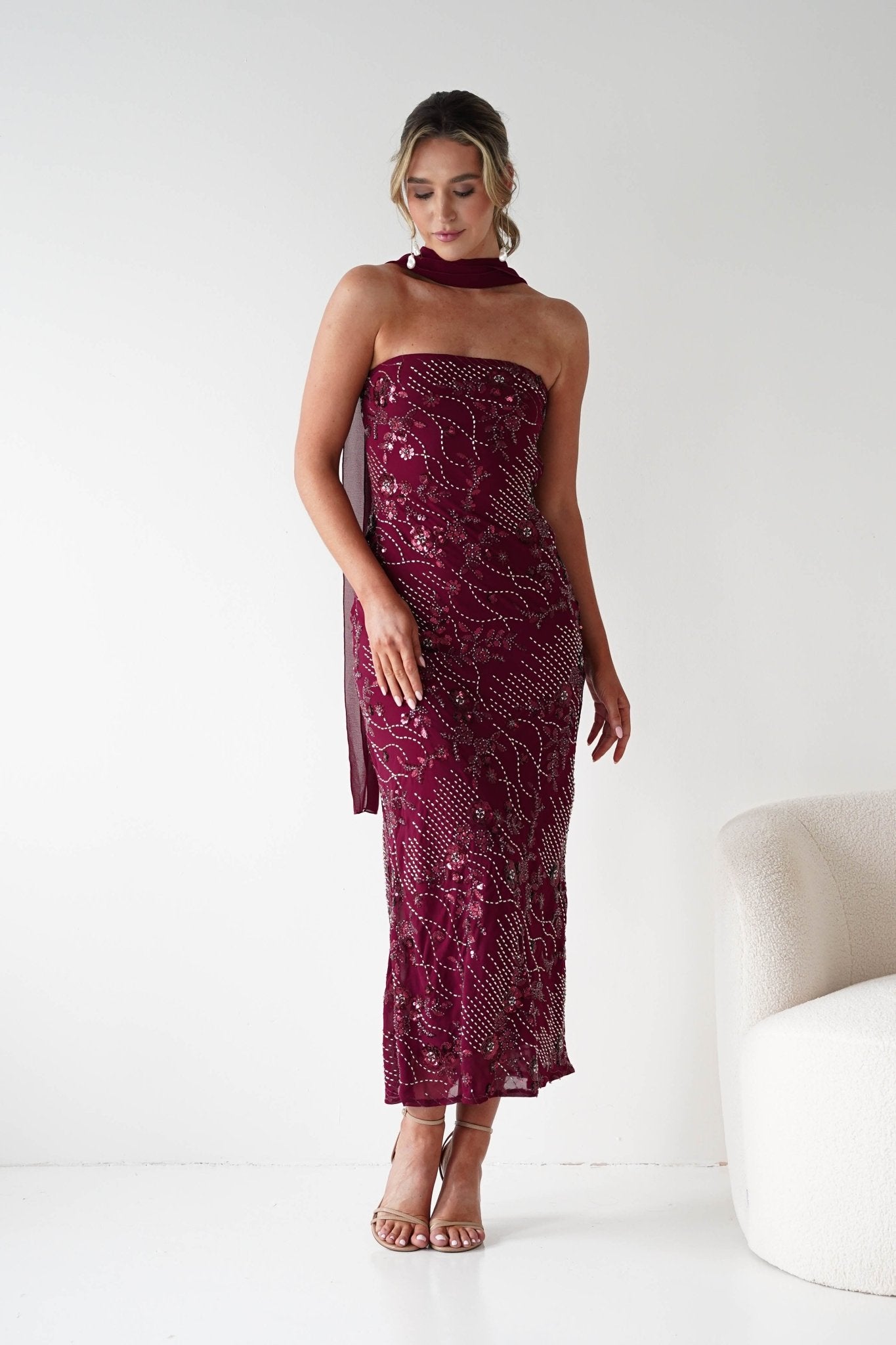 Hayleigh Beaded Strapless Maxi Dress in wine – movement shot | Velora premium burgundy dresses