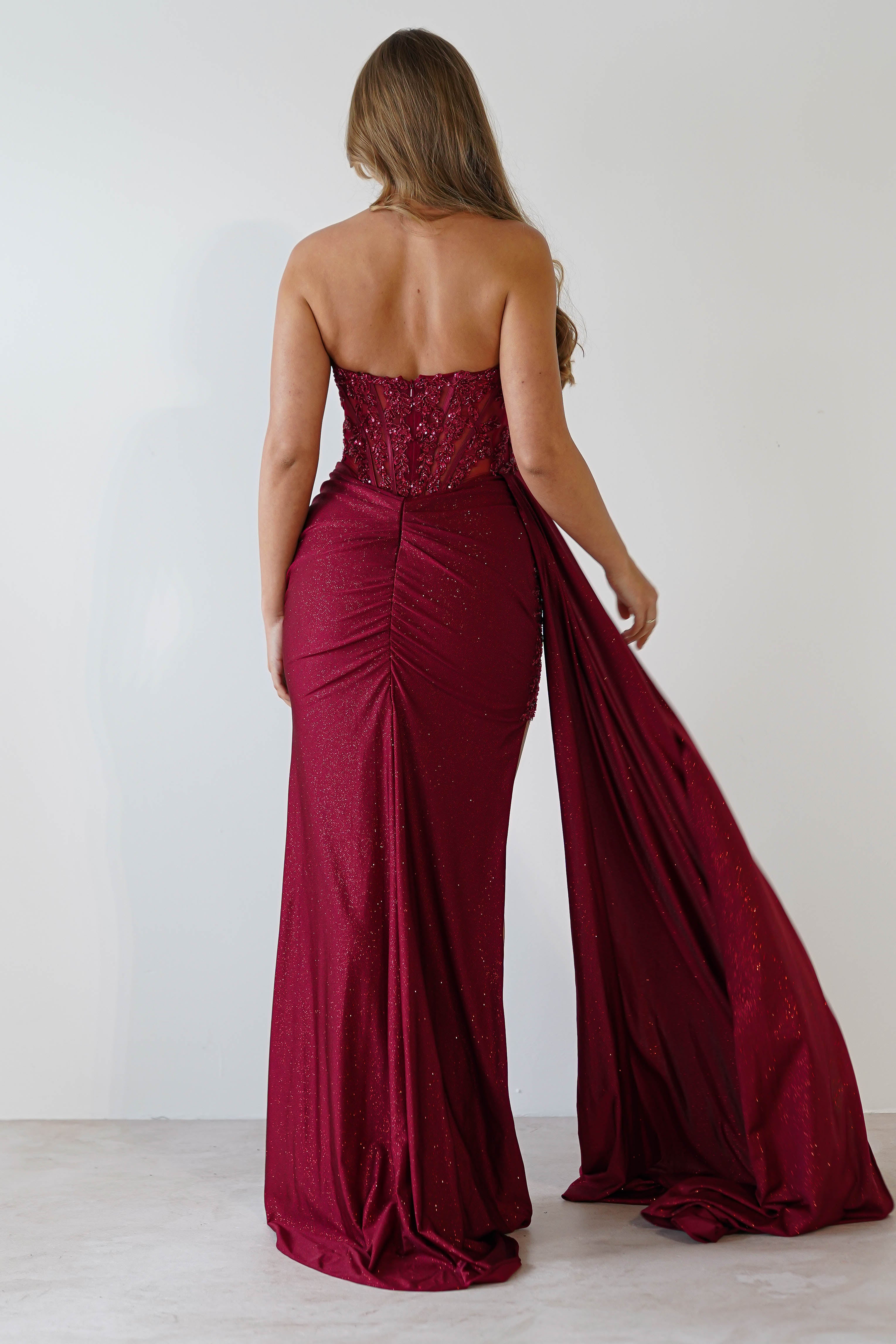 Lavelle Glitter Bodycon Gown in burgundy – styled with heels | Velora premium burgundy dresses