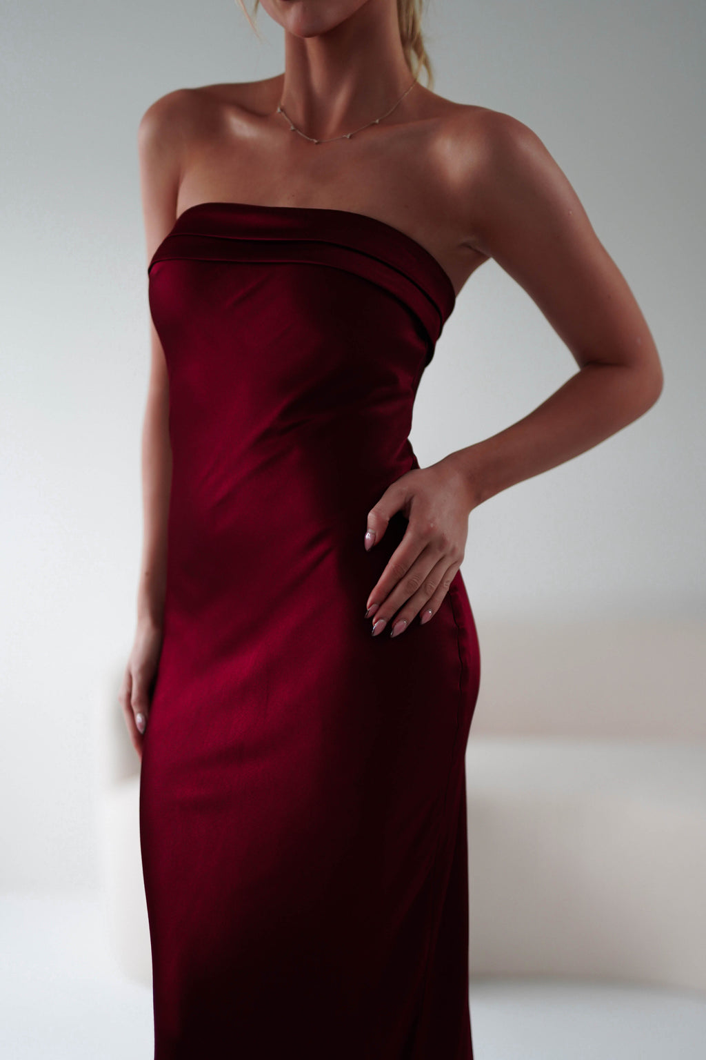 Lucia Soft Satin Strapless Midi Dress in wine – fabric detail | Velora premium burgundy dresses