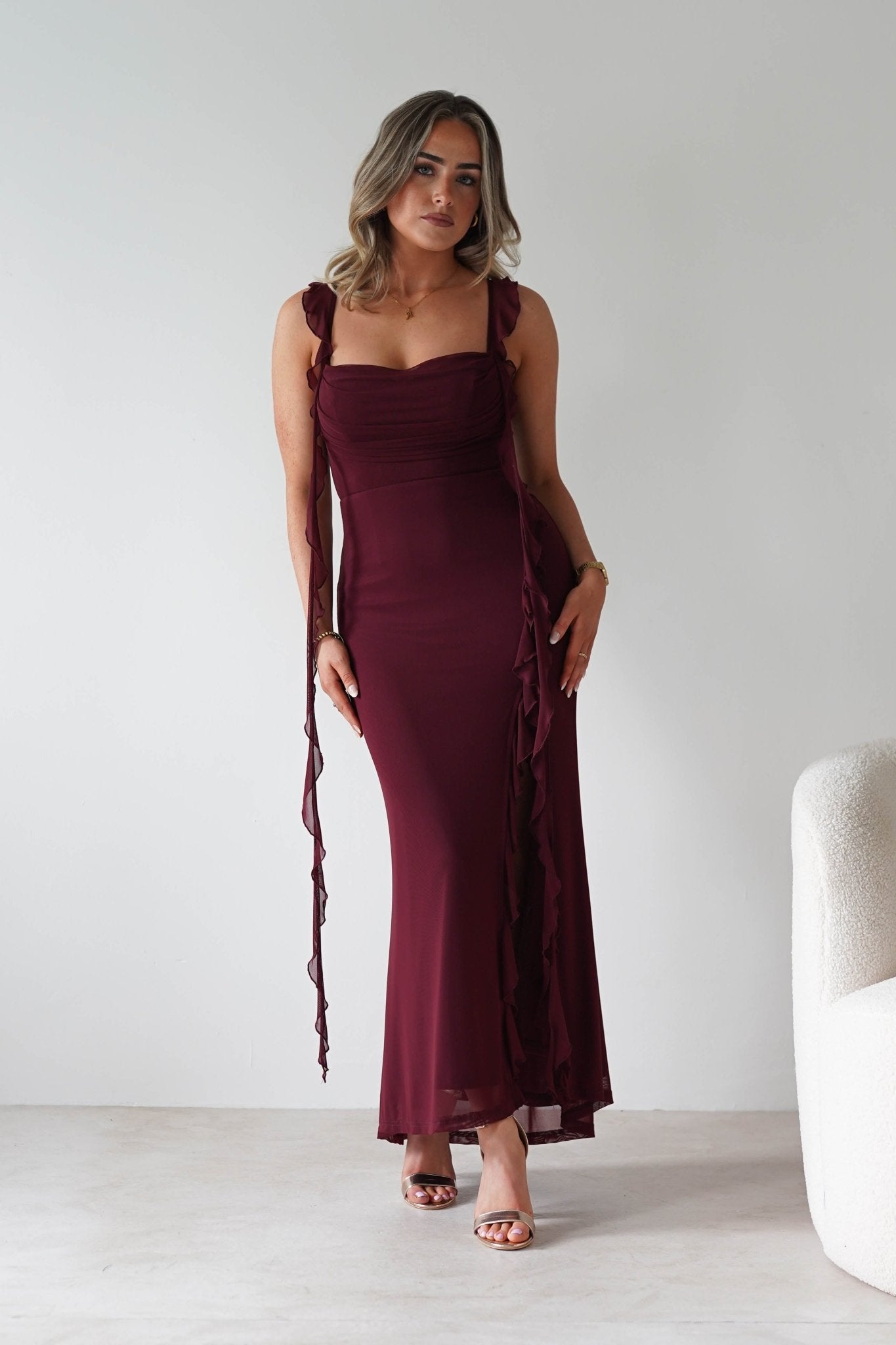 Mhissa Ruffle Maxi Dress in burgundy – seated view | Velora premium burgundy dresses