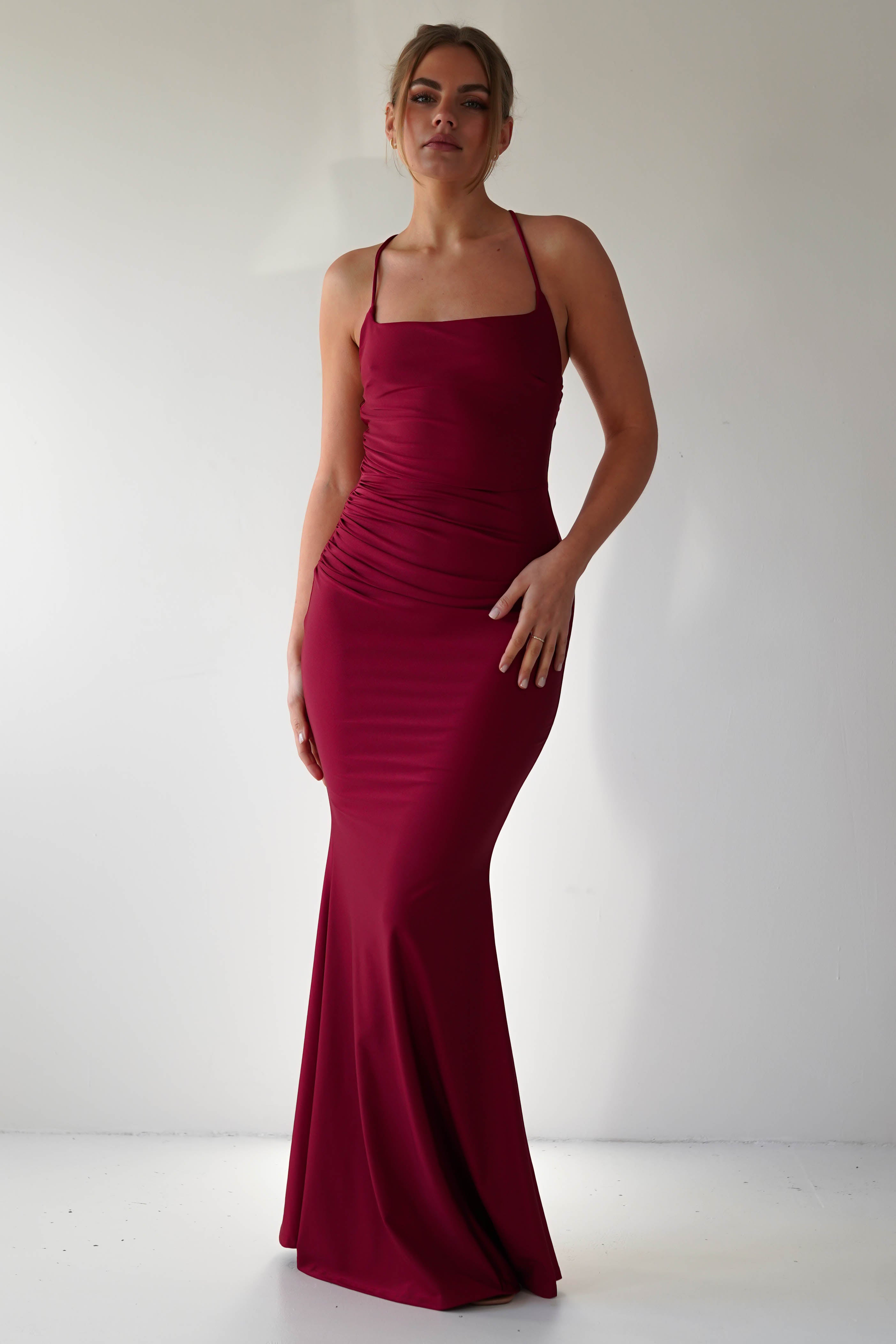 Monette Bodycon Maxi Gown in burgundy – styled with heels | Velora premium burgundy dresses