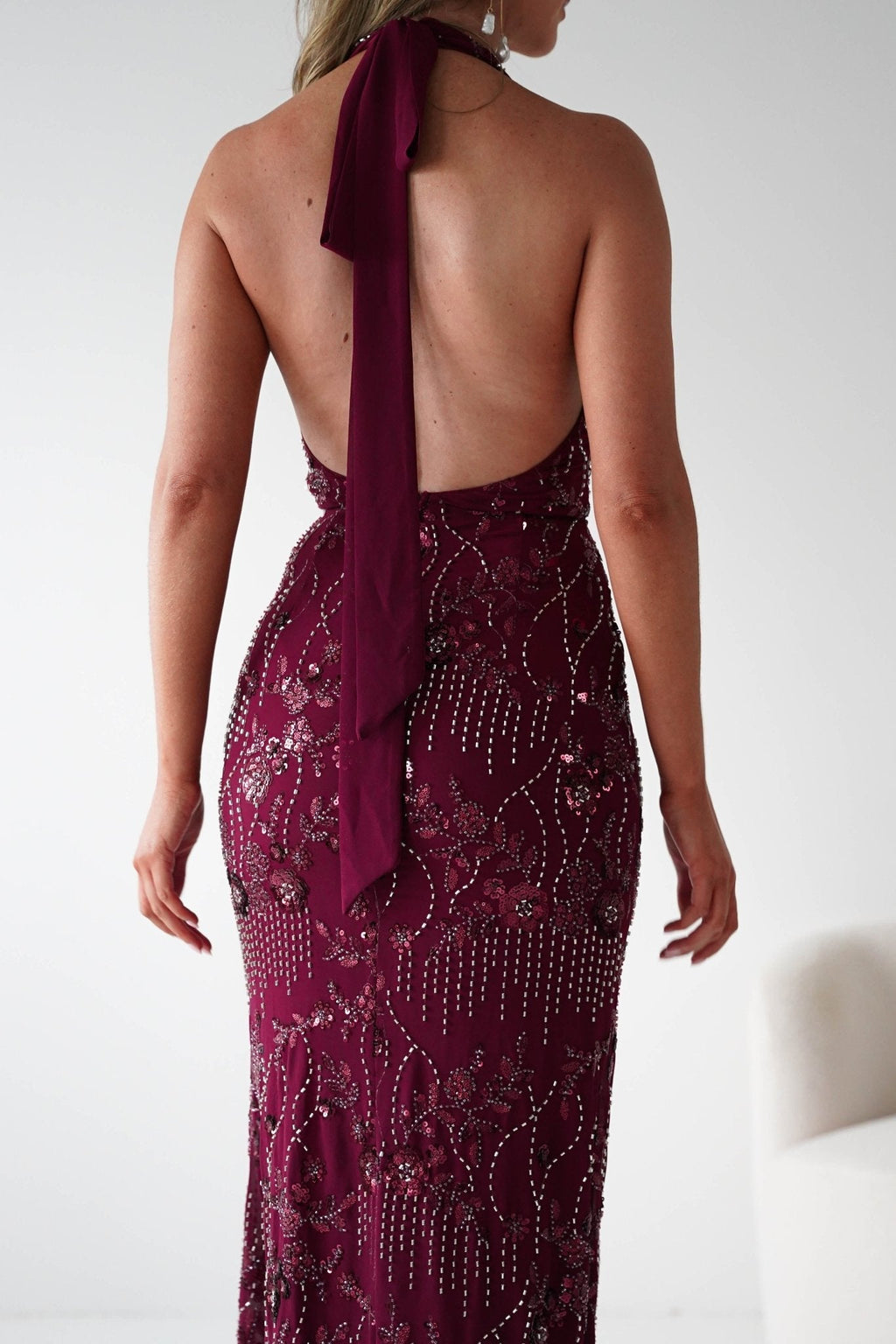 Sabrina Beaded Halterneck Maxi Dress in wine – seated view | Velora premium burgundy dresses